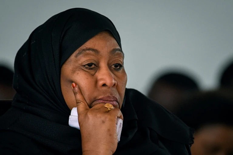 A woman in a black headscarf.