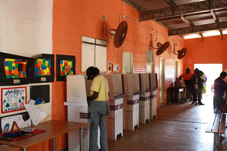 Man standing at ballot box