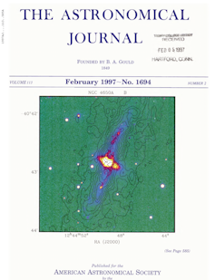 An image of the front cover of The Astronomical Journal showing a green and blue image of a galaxy.