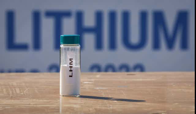 A vial of lithium picutred on a table.