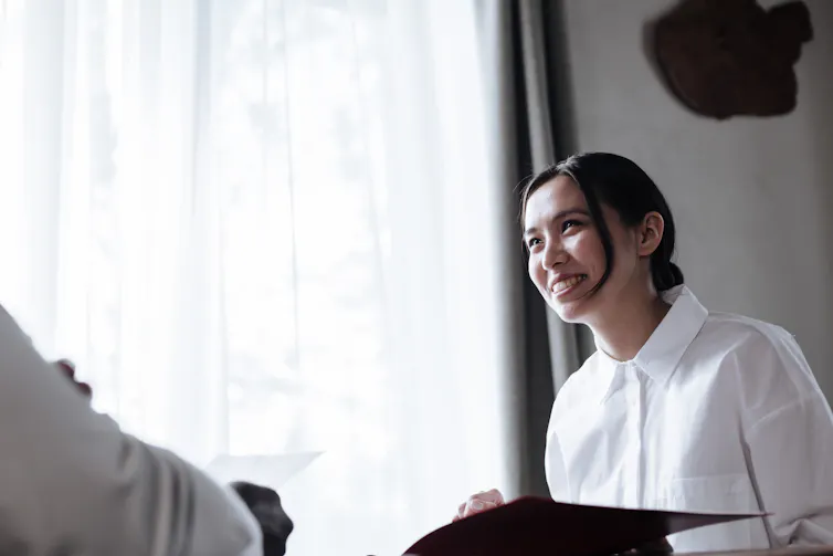 A young women listens.