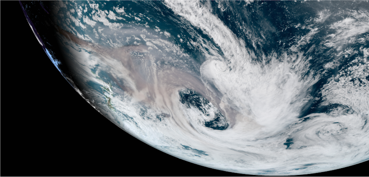 An image showing a portion of the globe, as seen from space, showing bushfire smoke mixing into the atmosphere.