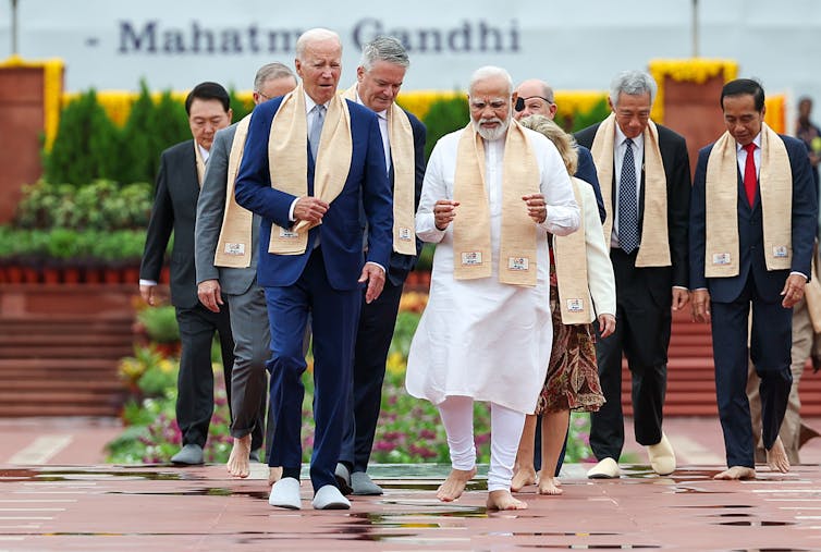 US president Joe Biden walks with INdian prime minister Narendra Modi at the Delhi G20 summit.