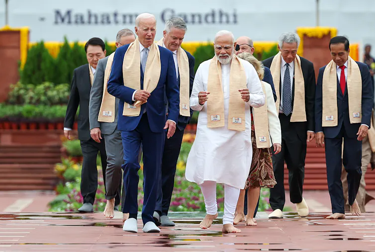 US president Joe Biden walks with INdian prime minister Narendra Modi at the Delhi G20 summit.