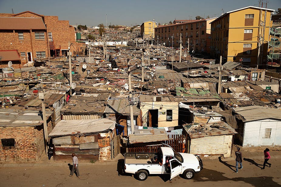 Crowded urban landscape of shacks and multiple storey buildings.