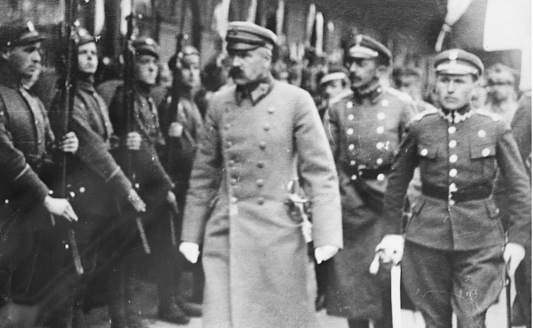Józef Piłsudski, Polish military officer inspecting a line of soldiers in 1919.