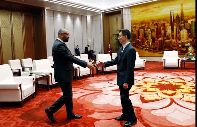 Foreign secretary James Cleverly shakes hand with Chinese vice president Han Zheng.