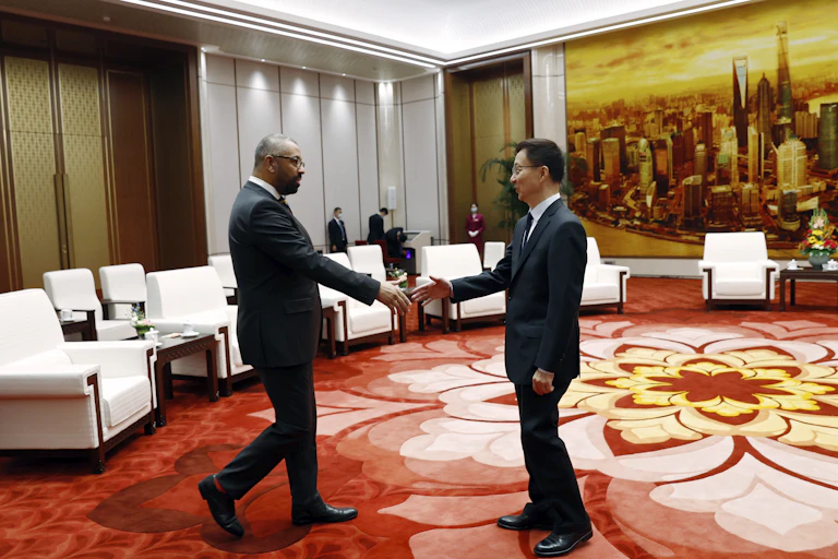 Foreign secretary James Cleverly shakes hand with Chinese vice president Han Zheng.