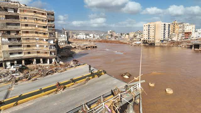A flooded street and destroyed bridge is seen in eastern Libya as a result of Mediterranean storm Daniel. 