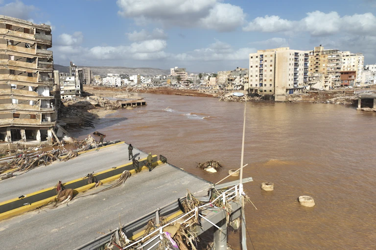 A flooded street and destroyed bridge is seen in eastern Libya as a result of Mediterranean storm Daniel.