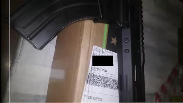 An assault rifle and an address label