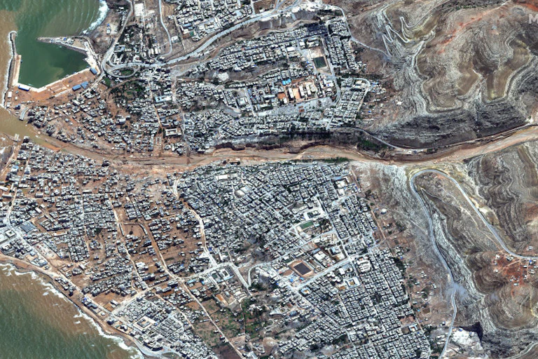Satellite image showing broken dan and flooding