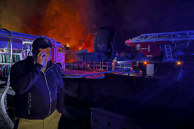 A handout photograph shows Sevastopol governor Mikhail Razvozhaev speaking on a mobile phone from the scene of the missile attack.