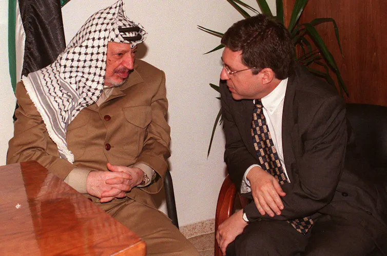 Palestine Liberation Organization leader Yasser Arafat and Israeli minister Yossi Beilin