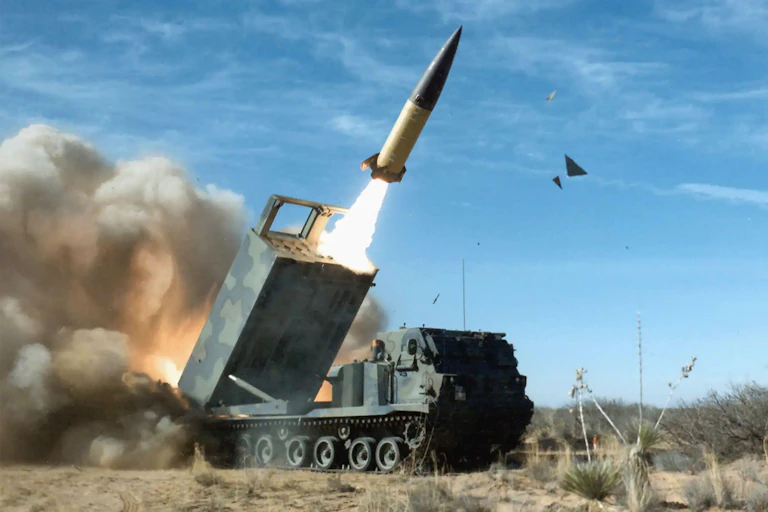 ATACMS - army tactical missiles - being fired from an M270 multiple launch rocket system.