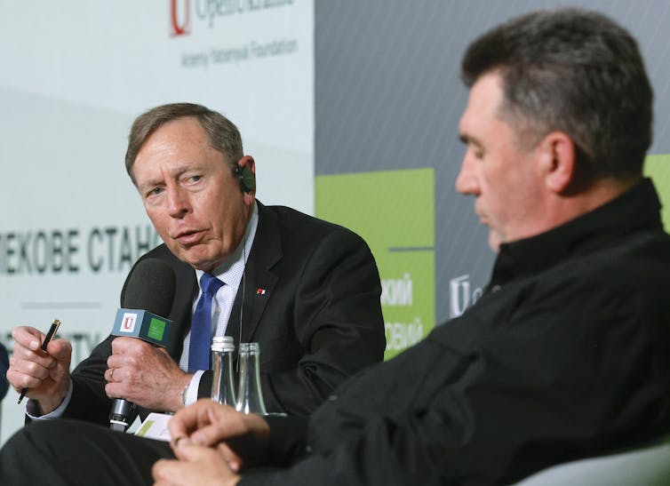 Oleksiy Danilov, head of Ukraine's National Security and Defence Council, with retired CIA director David Petraeus in a panel discussion, September 2023.