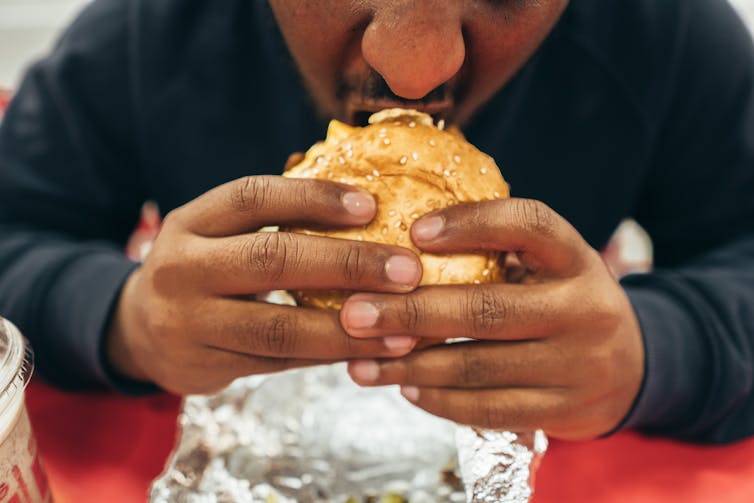 Man eating burger