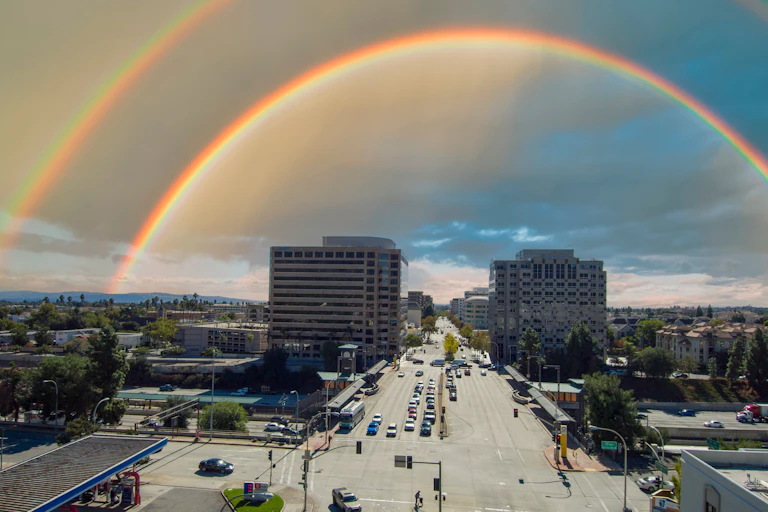 Aerial photo of Pasadena, California, under the arc of a double rainbow