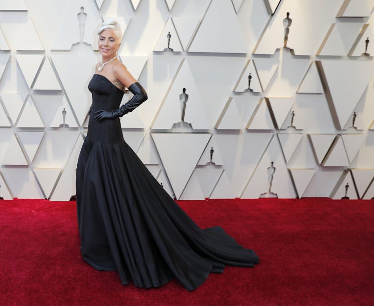 Lady Gaga on the Oscars red carpet in a sleeveless black dress
