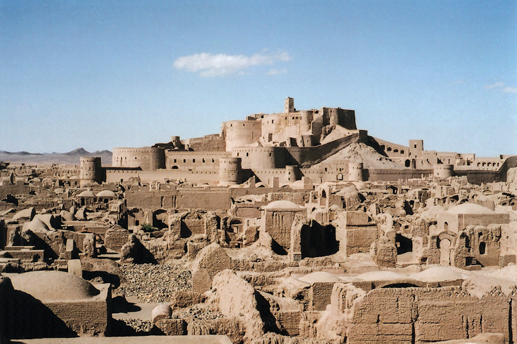A large adobe citadel on a hill.