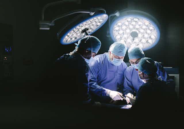 Surgeons at work in an operating theatre