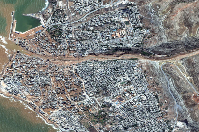 Satellite image showing broken dan and flooding