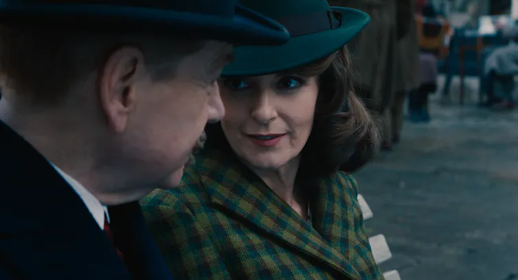 Ariadne Oliver talks to Poirot.