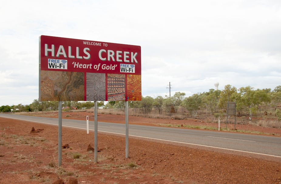 A street sign displays the words Halls Creek, which is a remote community in the Kimberley.