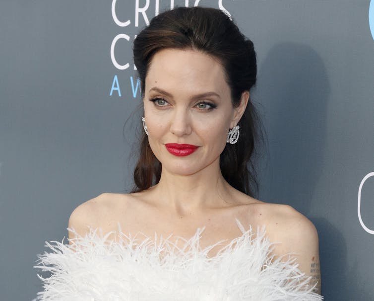 Angelina Jolie poses on the red carpet.
