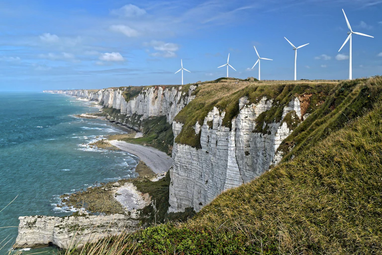 Wind turbins on a sea cliff.