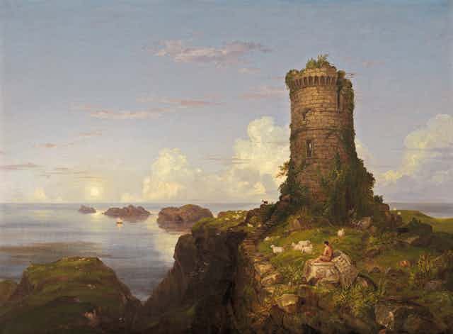 A pastoral, coastal scene of a shepherd and his flock resting near a crumbling tower.