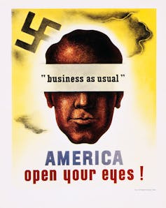 A yellow and white illustration of a man's head next to a swastika, with his eyes covered by the phrase 'business as usual.' The bottom says 'America open your eyes!'