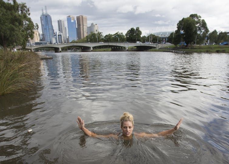 A woman swimming in a river