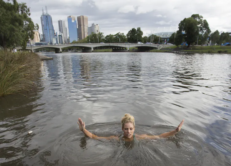 A woman swimming in a river