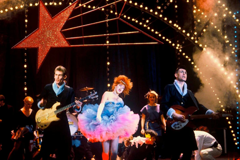 Film still: a band on stage