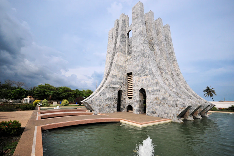A marble structure surrounded by water