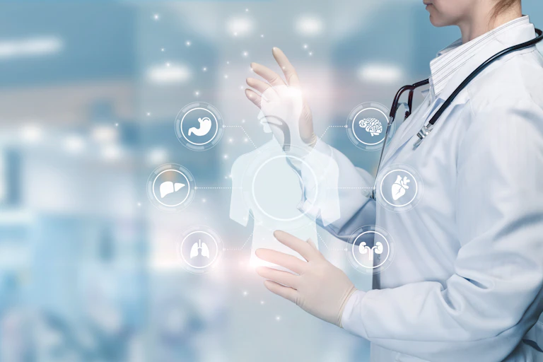 Cropped image of a person in a white coat and stethoscope with an illustration of a human figure and organ systems