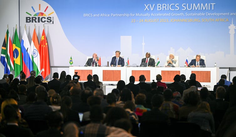 A group of world leaders on a stage