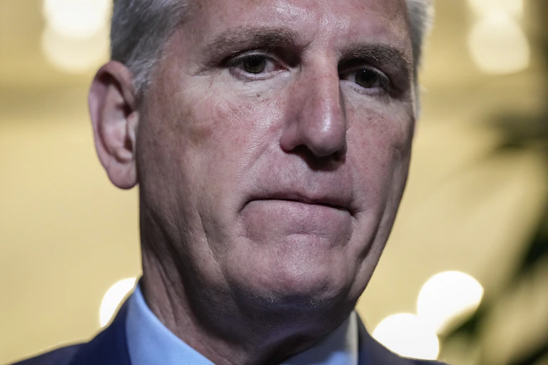 A sad-looking man in a suit.