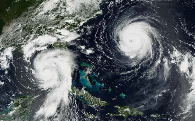 Two hurricanes. Franklin, more powerful at that point, has a clear eye wall.