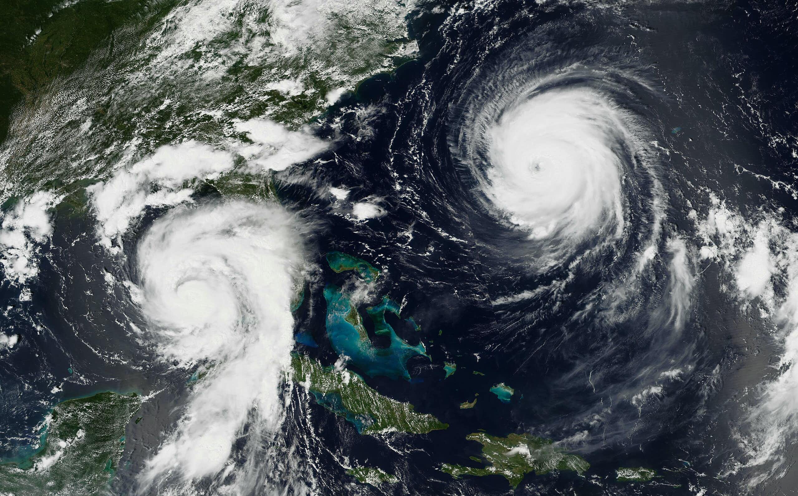 Two hurricanes. Franklin, more powerful at that point, has a clear eye wall.