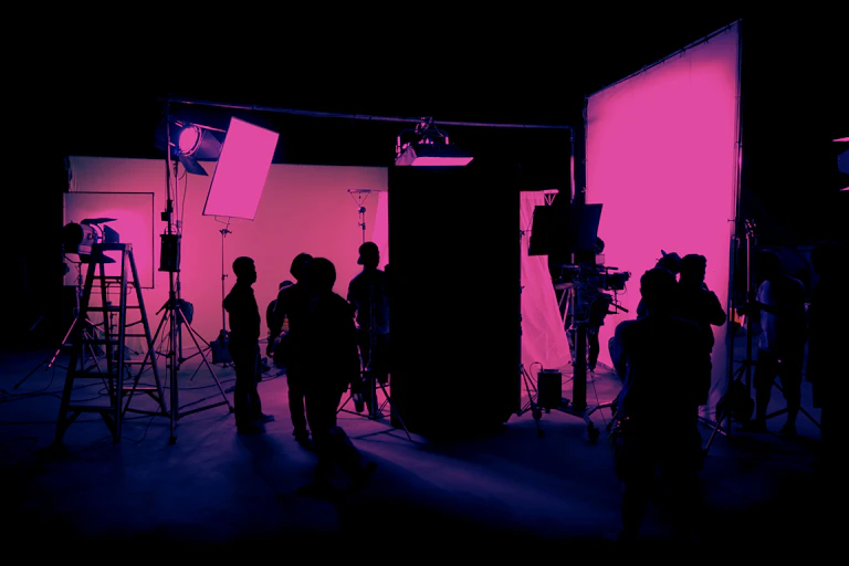 A TV set bathed in pink light