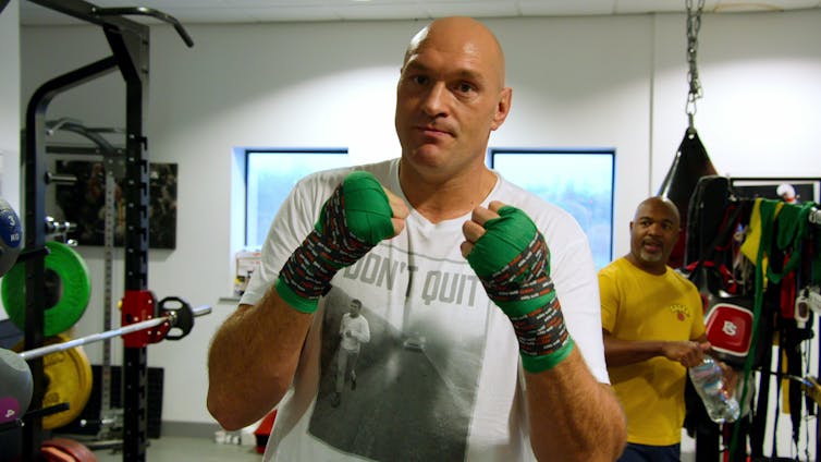 Tyson Fury holds his fists up to the camera.