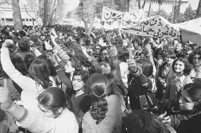 A black and white photo shows women protesting in 1979.