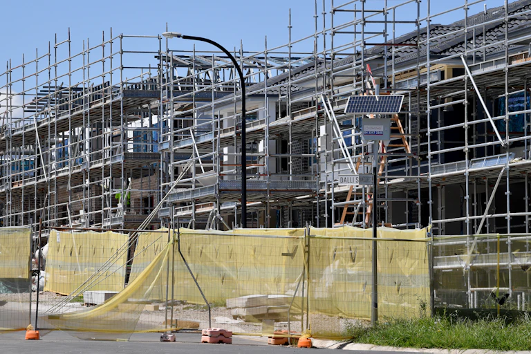Scaffolding around housing under construction