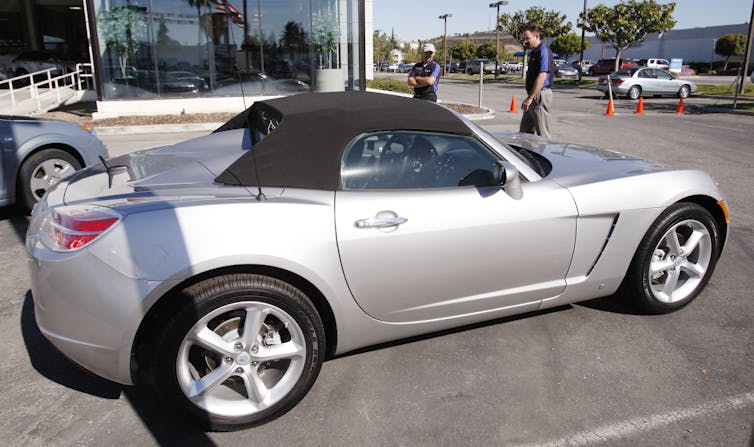 A sporty silver two-door sedan