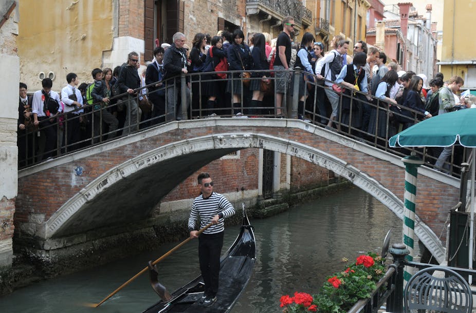 A crowded bridge in Venice.