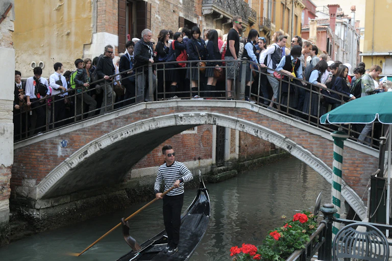 A crowded bridge in Venice.