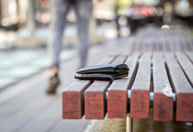 Left-behind wallet on a bench.