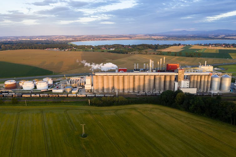 An aerial view of a factory in a rural landscape.